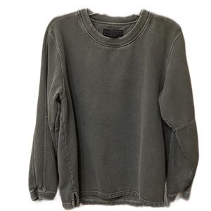 Grey sweatshirt with intentional “grunge-like” appearance.